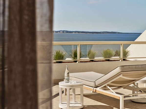 Terrace King Suite with Bay View | In-room safe, desk, iron/ironing board, free cribs/infant beds