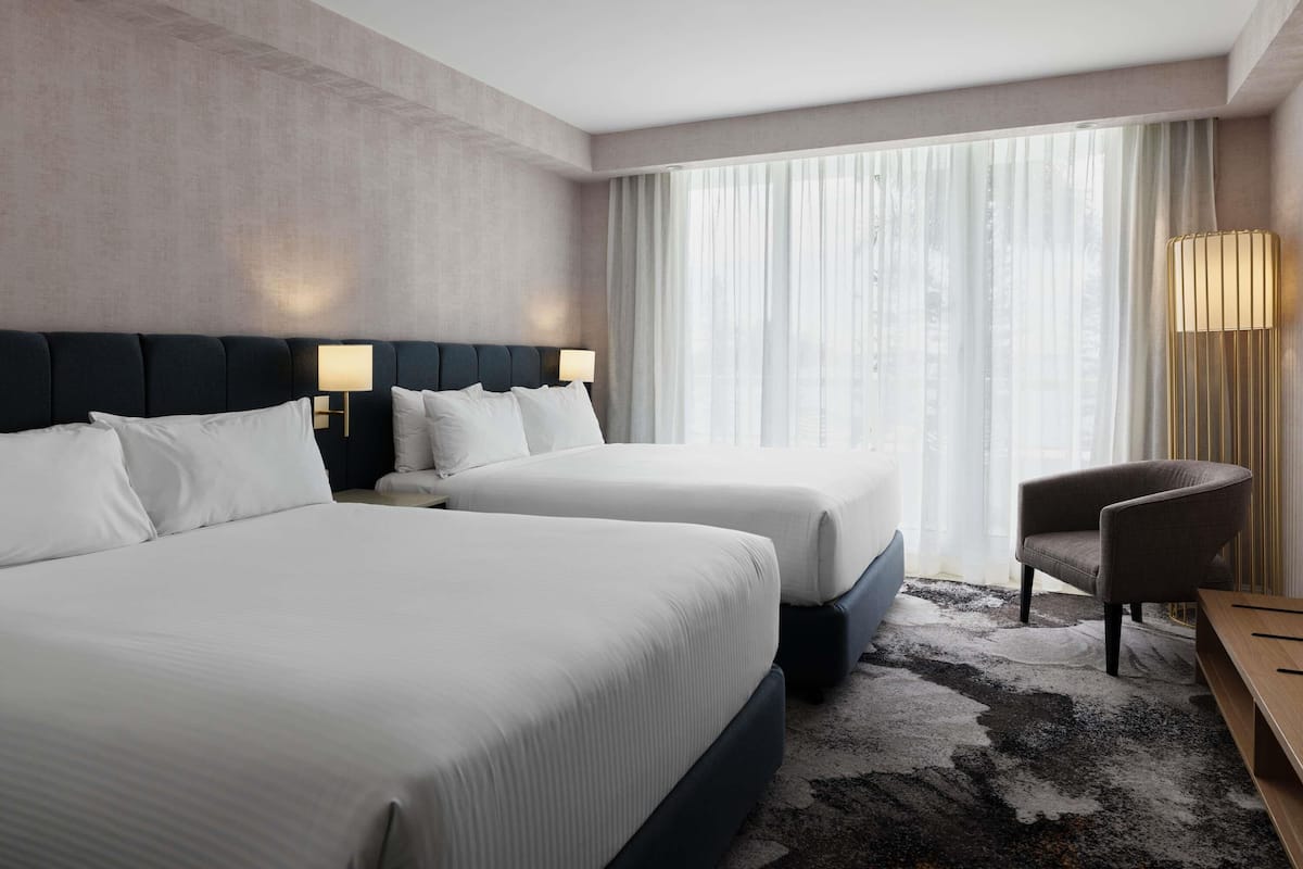 Superior Room with Two Queen Beds and City view | In-room safe, desk, iron/ironing board, cribs (free)