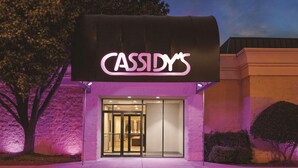 A building with a neon sign reading "CASSIDY'S" above the entrance. - Radisson Hotel Fort Worth North-Fossil Creek (Fort Worth)