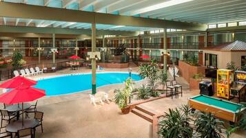 Relax by the pool surrounded by lounge chairs and umbrellas, or enjoy a game of pool at the on-site table.