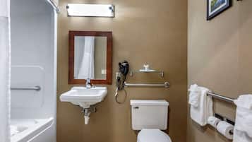 A bathroom with a sink, toilet, and shower.