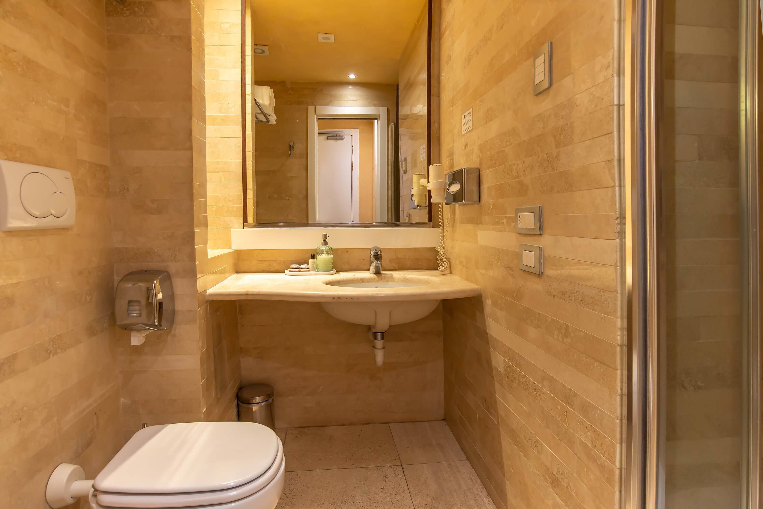 free toiletries, hair dryer, bidet, towels