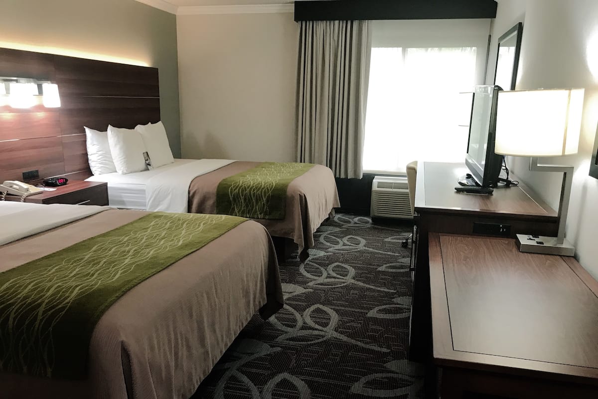 Pillowtop beds, desk, blackout drapes, iron/ironing board