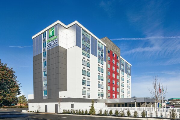 Welcome to Holiday Inn Express, featuring a contemporary design with a prominent entrance.