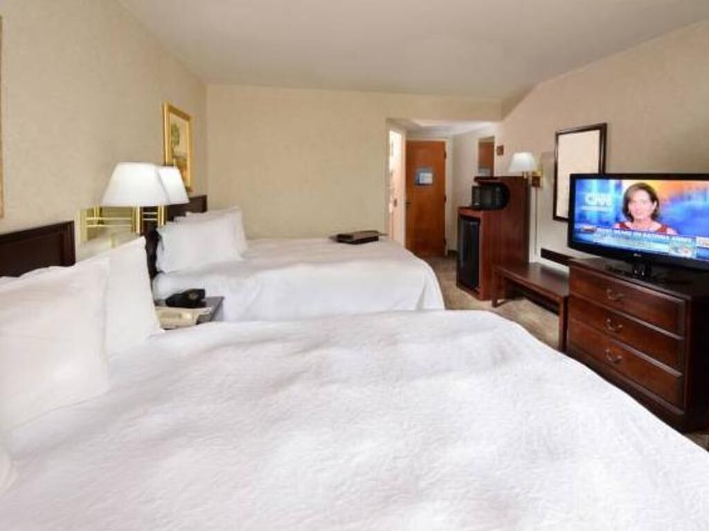 Premium bedding, desk, laptop workspace, blackout curtains