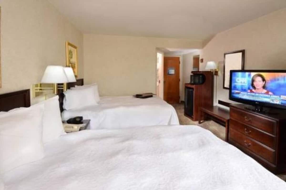 Premium bedding, desk, laptop workspace, blackout curtains