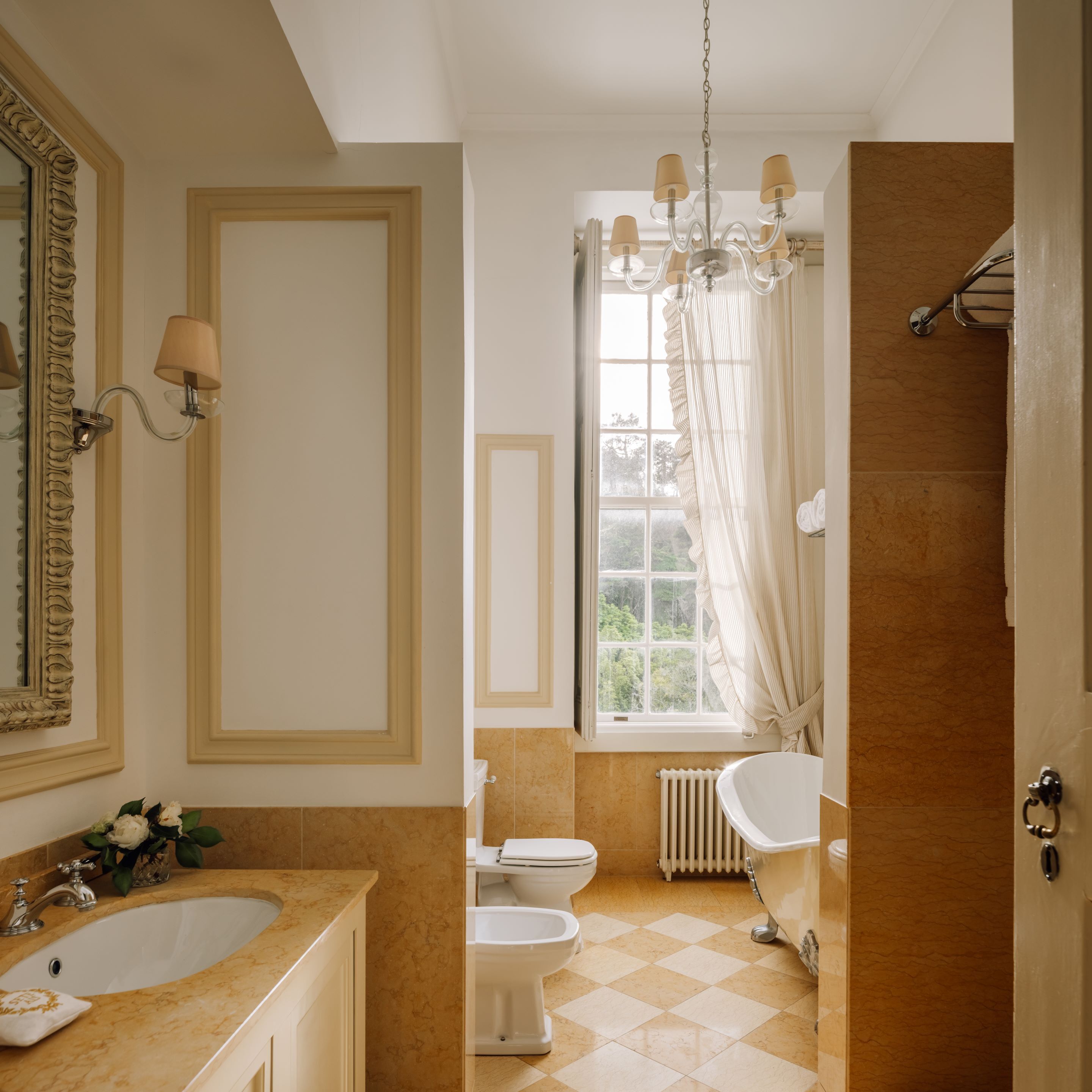 junior suite | bathroom | combined shower/bathtub, eco-friendly toiletries, hair dryer, bathrobes