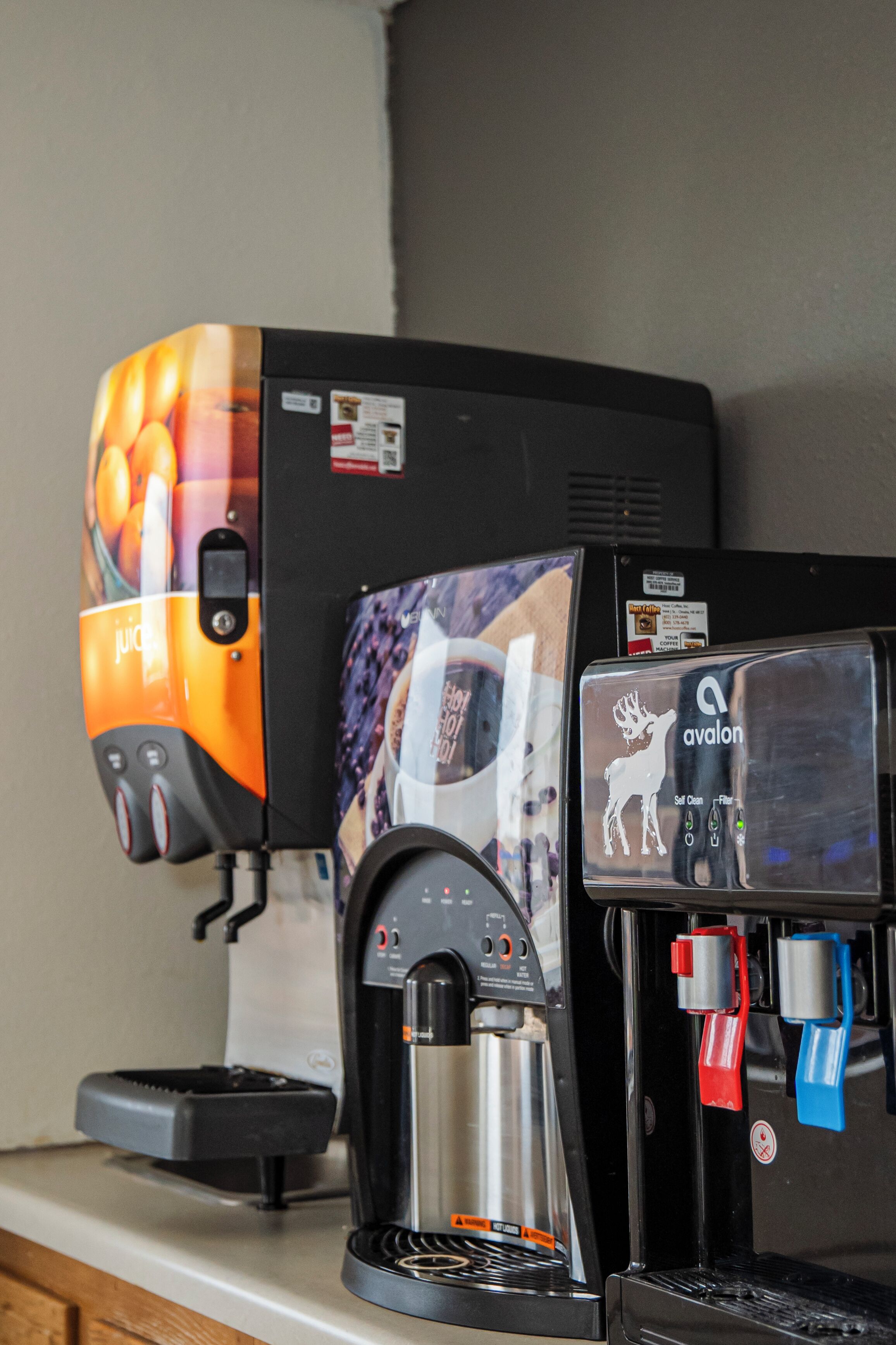 A coffee machine with a colorful design and a separate espresso machine.