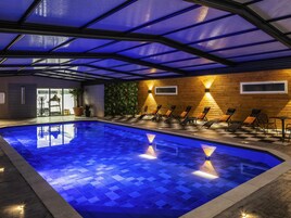 Indoor pool, open 6:00 AM to 10:00 PM, sun loungers
