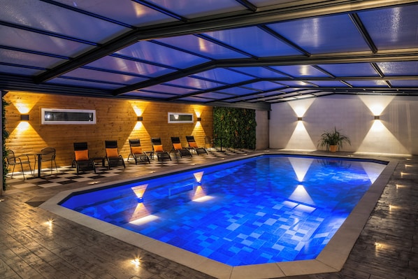 Indoor pool, open 6:00 AM to 10:00 PM, pool loungers