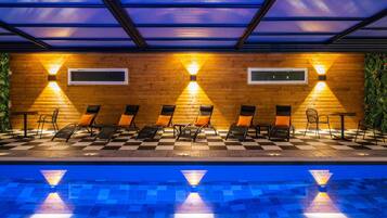 Indoor pool, open 6:00 AM to 10:00 PM, pool loungers