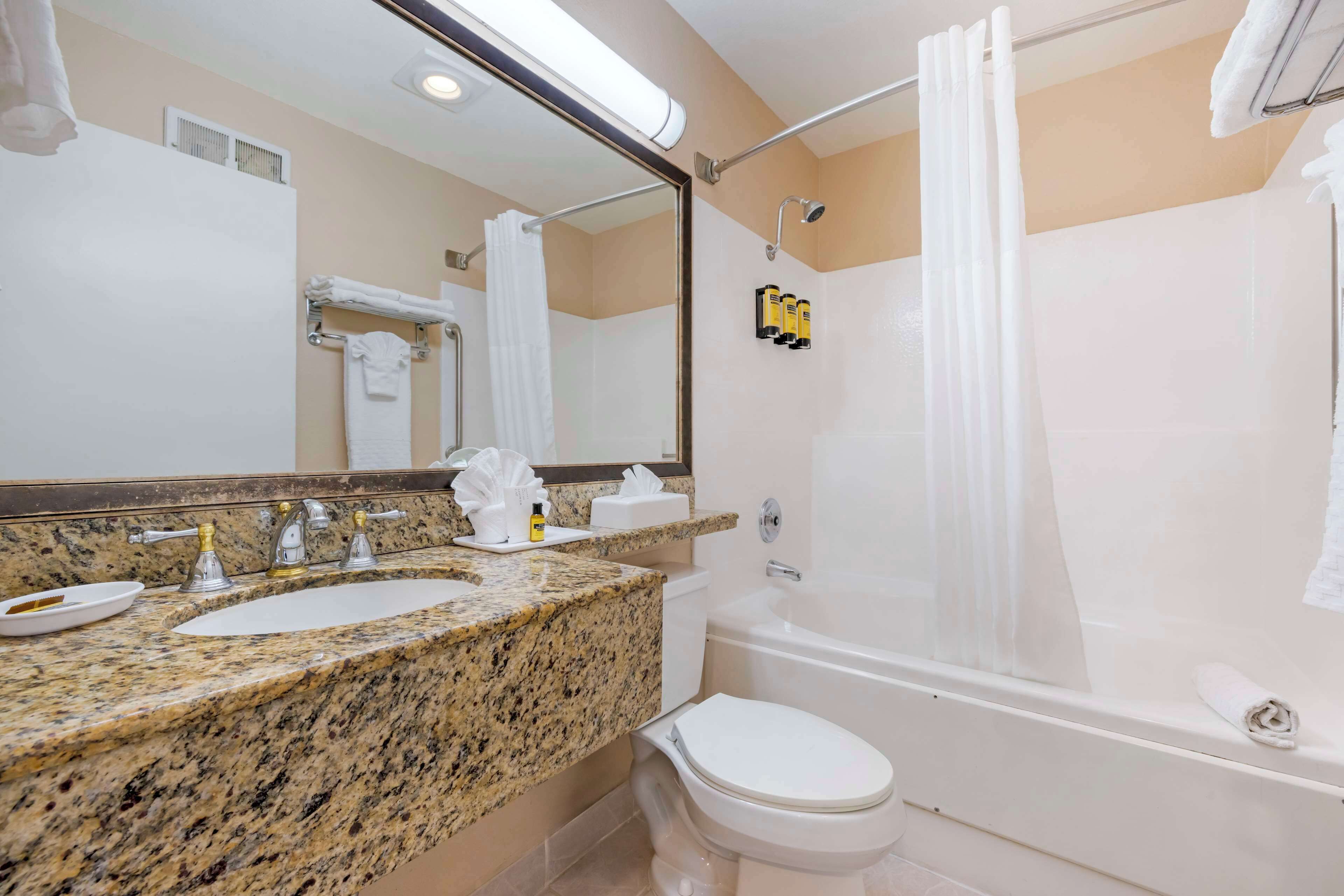 suite, 2 queen beds, non smoking, balcony | bathroom | combined shower/bathtub, hair dryer, towels