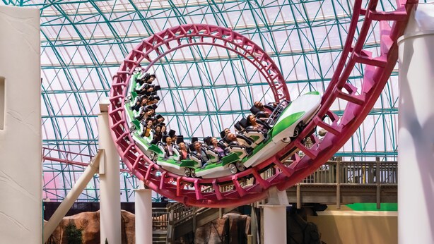 A roller coaster in a glass-roofed indoor amusement park. - Circus Circus Hotel, Casino & Theme Park (Las Vegas)
