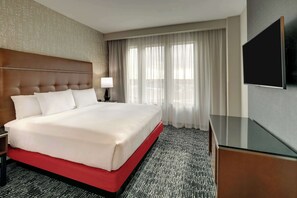 Premium bedding, desk, laptop workspace, blackout curtains