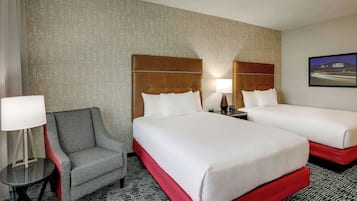 Premium bedding, desk, laptop workspace, blackout drapes