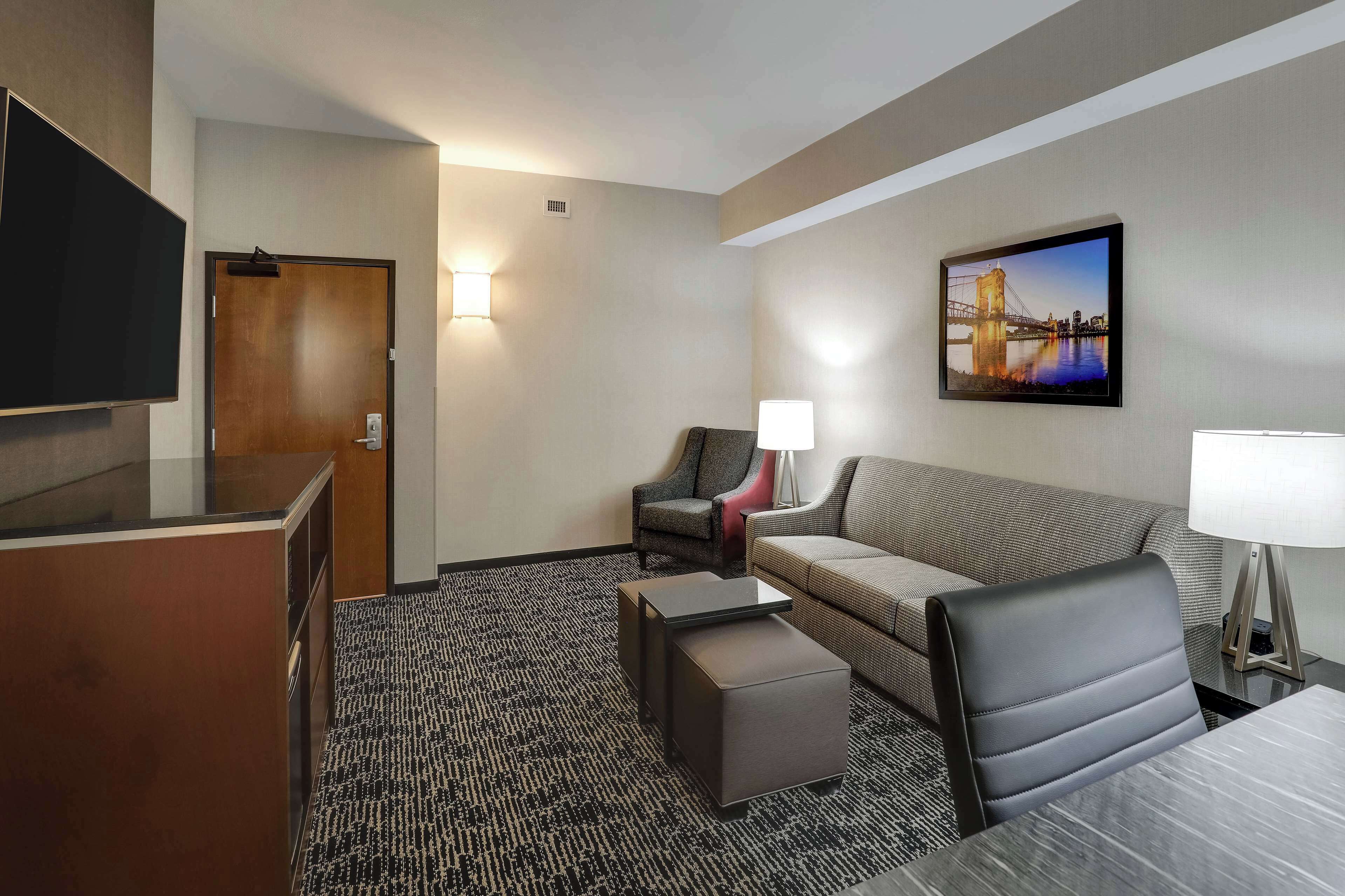 Premium bedding, desk, laptop workspace, blackout drapes