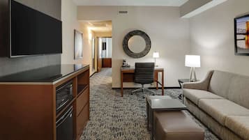 Premium bedding, desk, laptop workspace, blackout drapes