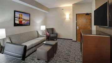 Premium bedding, desk, laptop workspace, blackout drapes