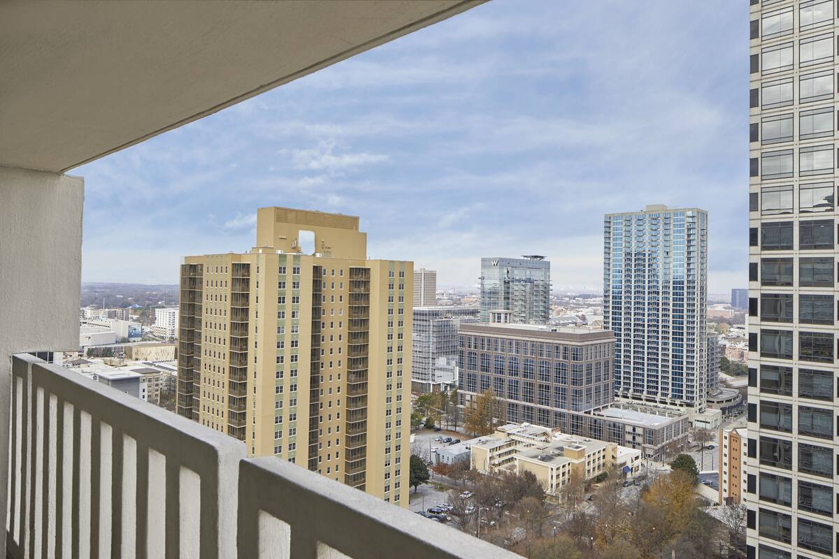 A high-rise building with a modern architectural design, featuring multiple floors and a prominent corner structure.