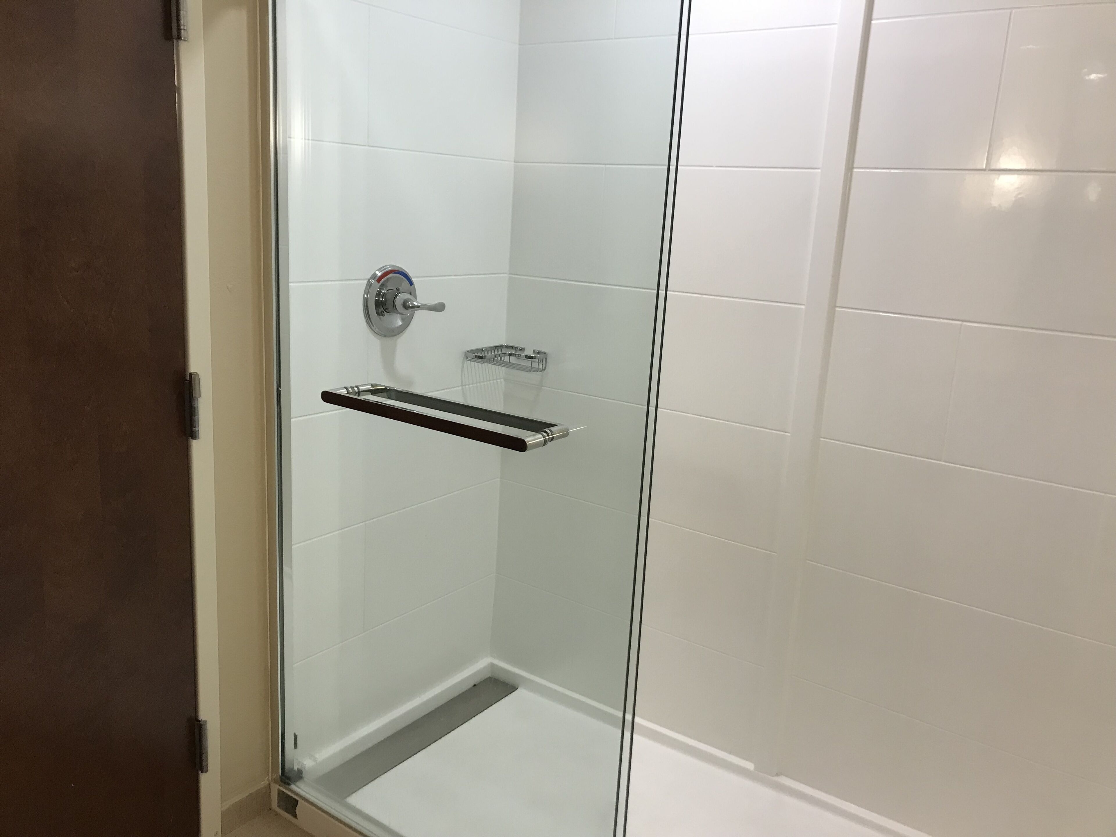 suite, 1 king bed with sofa bed, non smoking | bathroom | combined shower/bathtub, rainfall showerhead, free toiletries