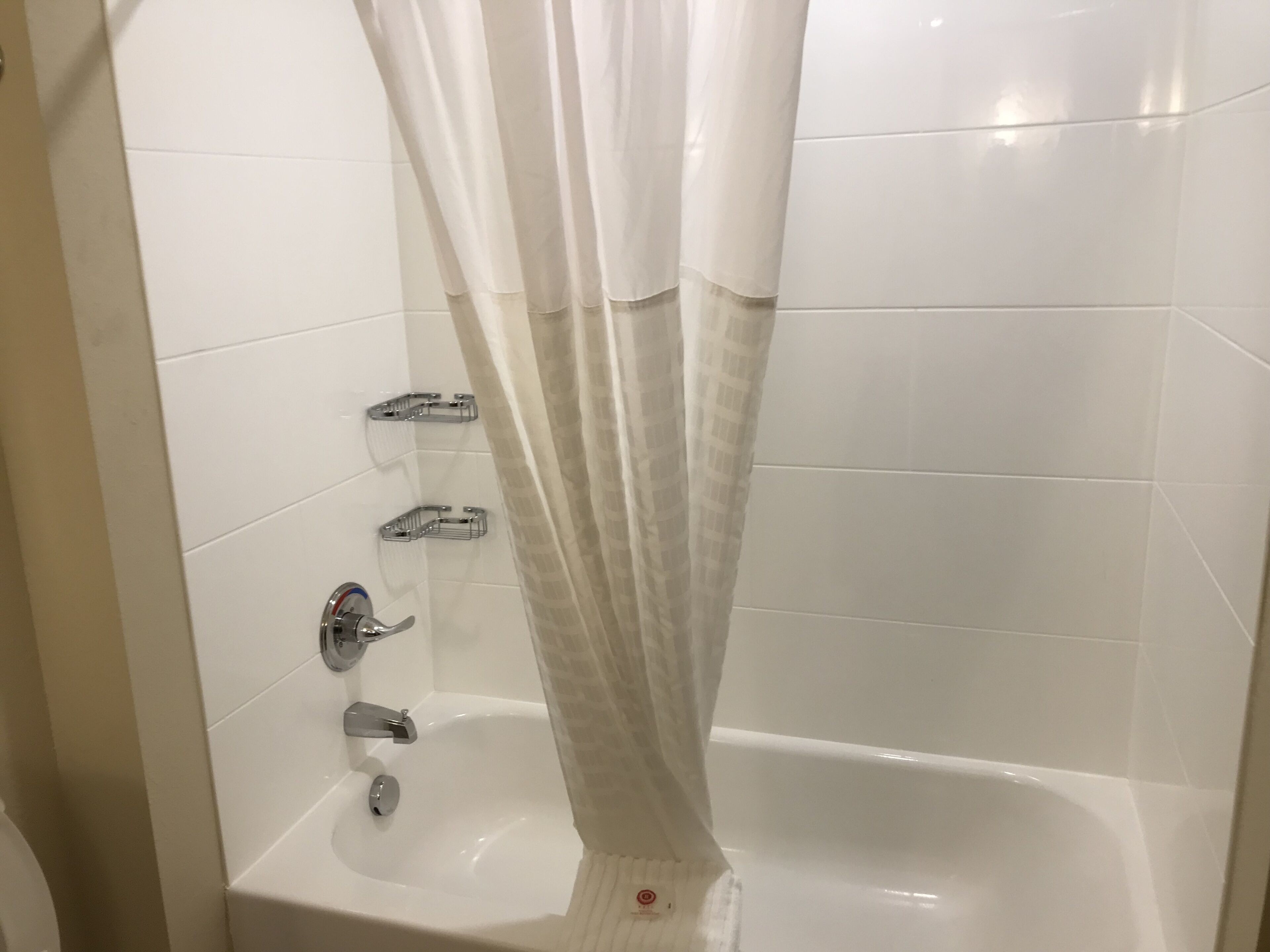 suite, multiple beds, non smoking | bathroom | combined shower/bathtub, rainfall showerhead, free toiletries