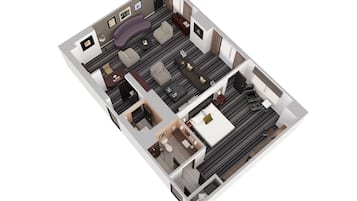 A 3D floor plan of a hotel room with a living area, a separate bedroom, a bathroom, and a small balcony.