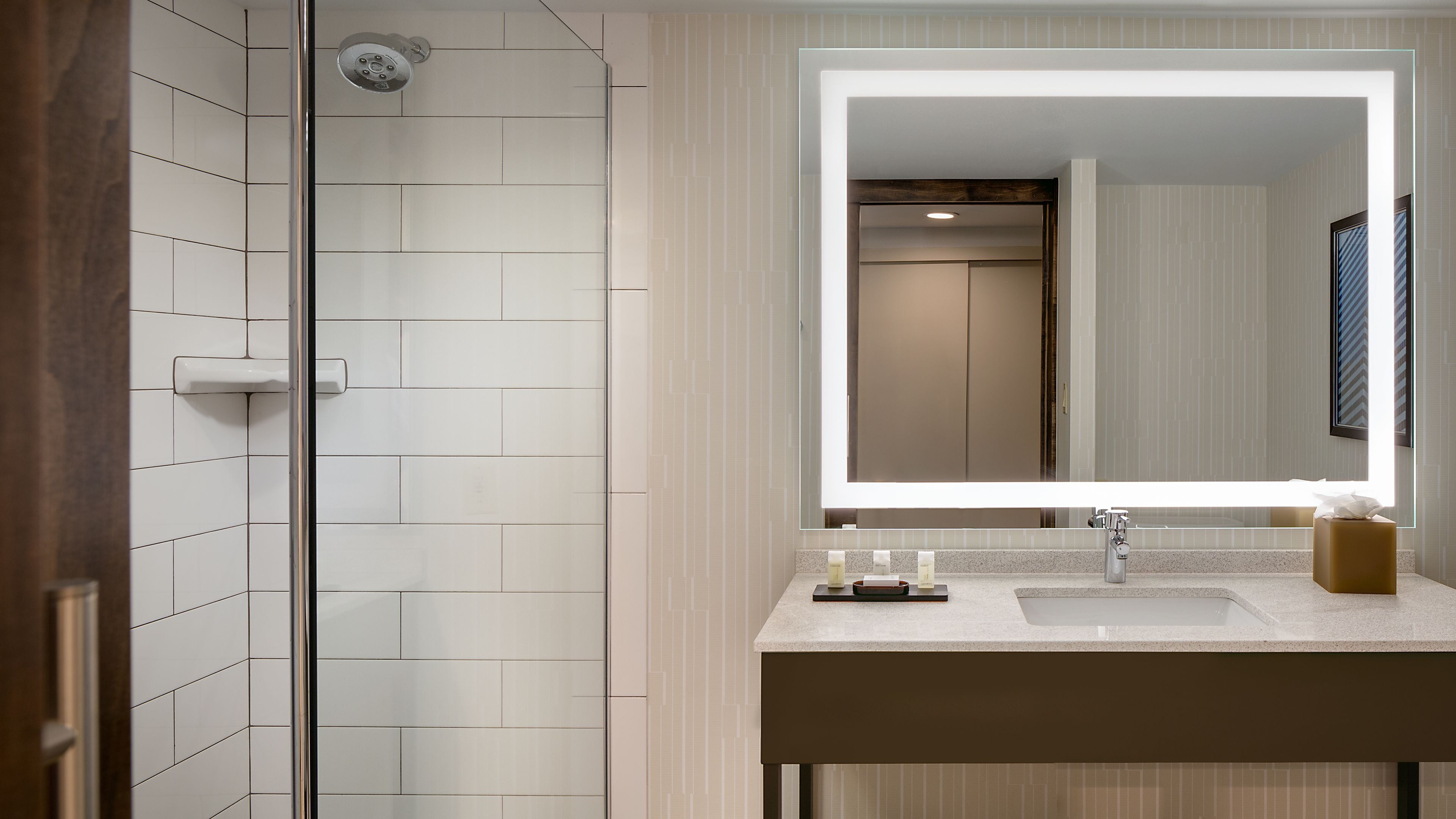 combined shower/bathtub, designer toiletries, hair dryer, towels