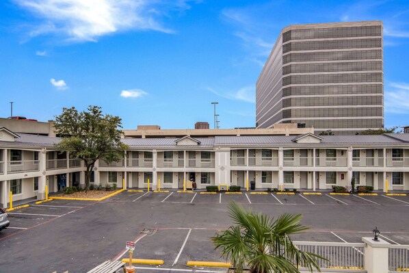 Guests can enjoy a convenient stay at this motel with a central entrance and balconies on each floor.
