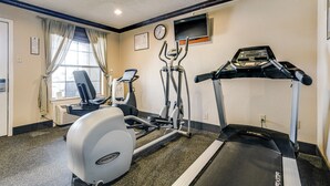 A gym with a treadmill, elliptical, and stationary bike. - Quality Inn & Suites Dallas - Cityplace (Dallas)
