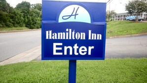 A blue sign with the text "Hamilton Inn Enter" and a stylized 'H' logo. - Hamilton Inn Jonesville NC (Jonesville)
