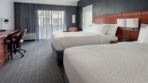 A hotel room with two beds, a desk, and a chair. - Courtyard by Marriott Silver Spring North/White Oak (Silver Spring)
