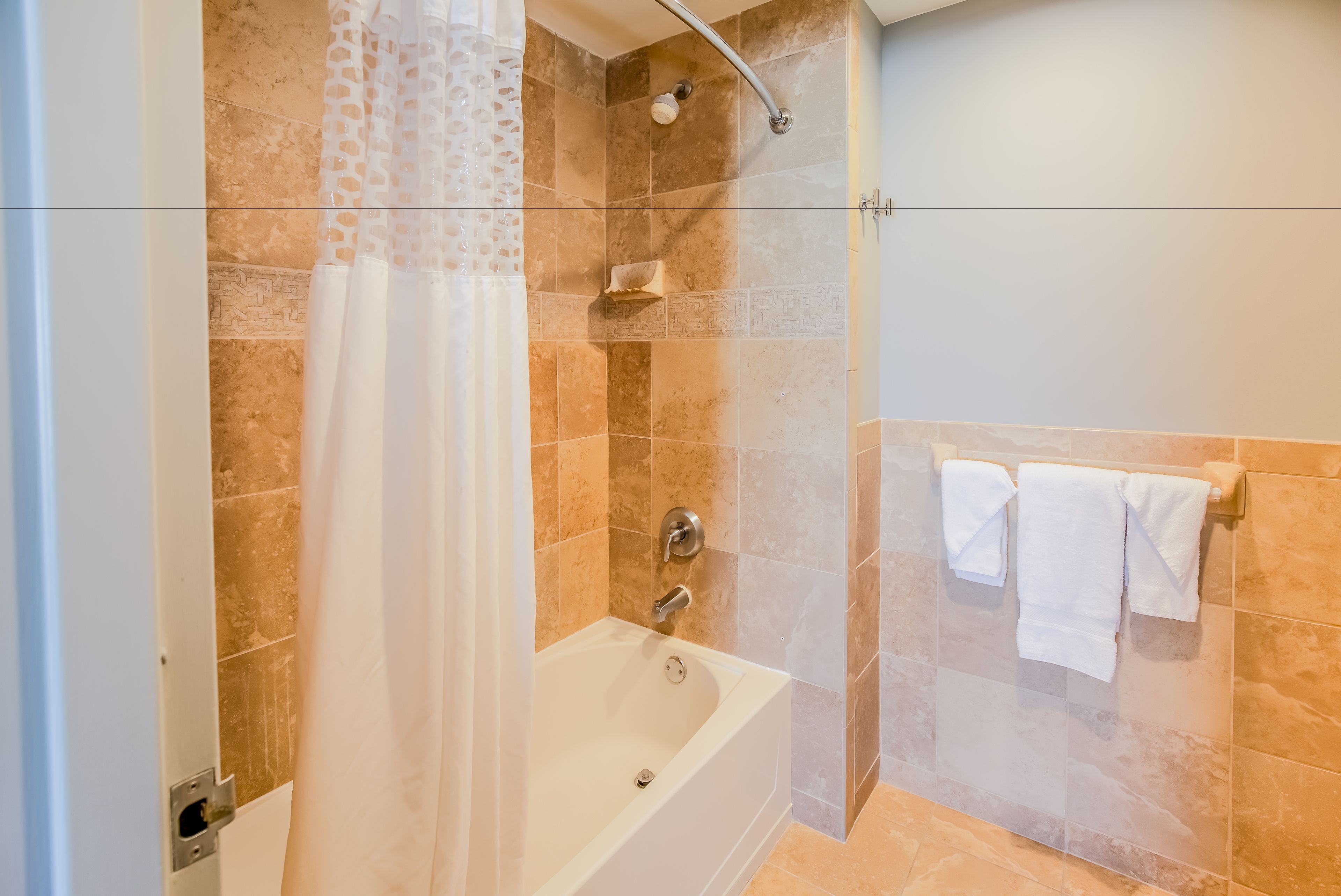 1 bedroom suite w/kitchen, 2 balconies, gulf front, non-smoking | bathroom | combined shower/bathtub, eco-friendly toiletries, hair dryer, towels