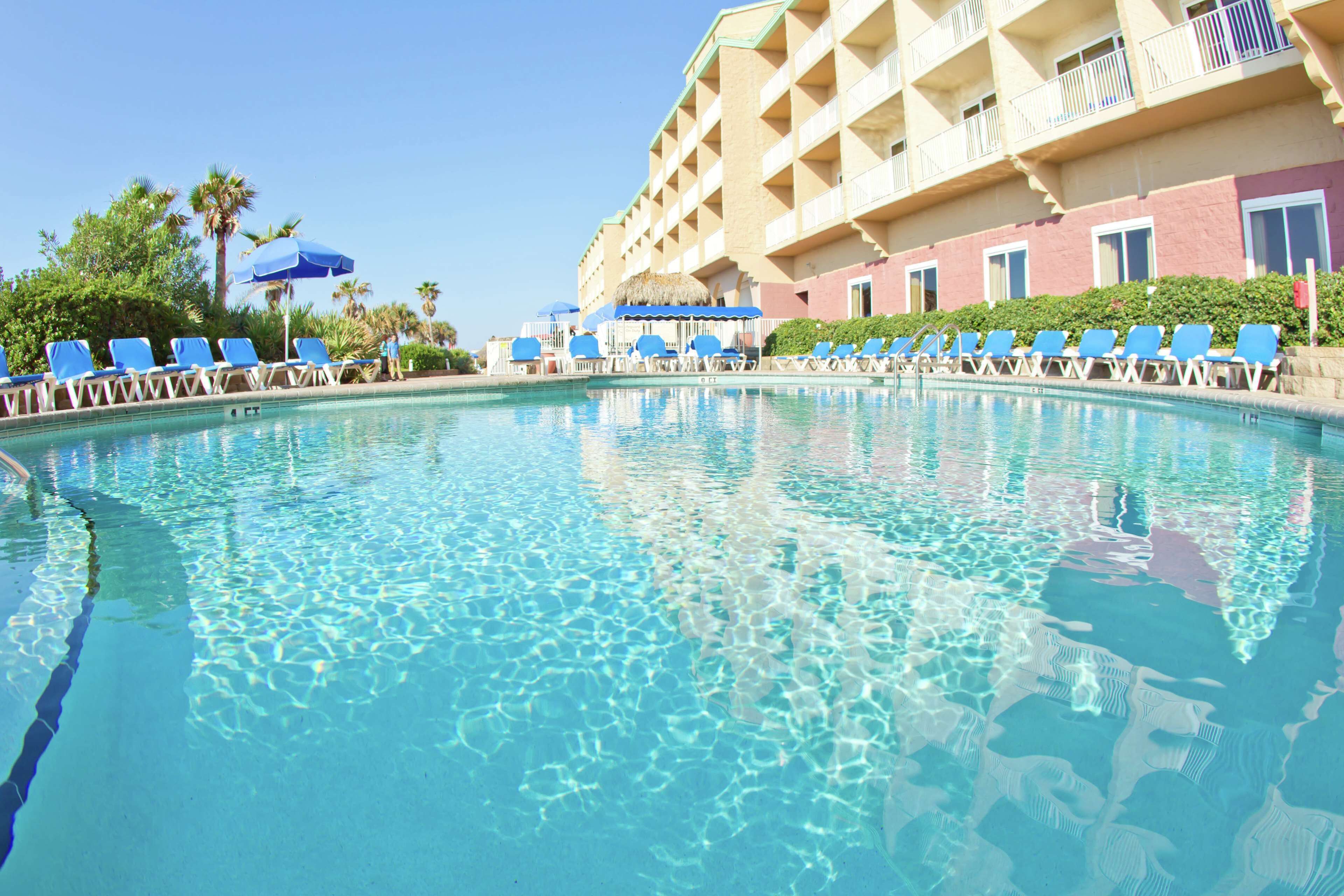 2 outdoor pools, a heated pool, pool umbrellas, pool loungers