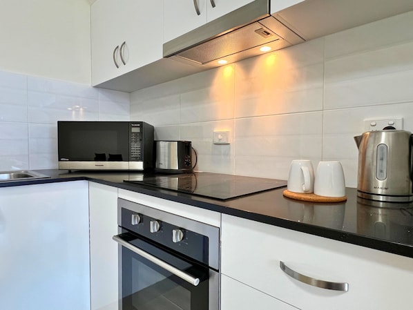 Apartment | Private kitchen | Microwave, electric kettle