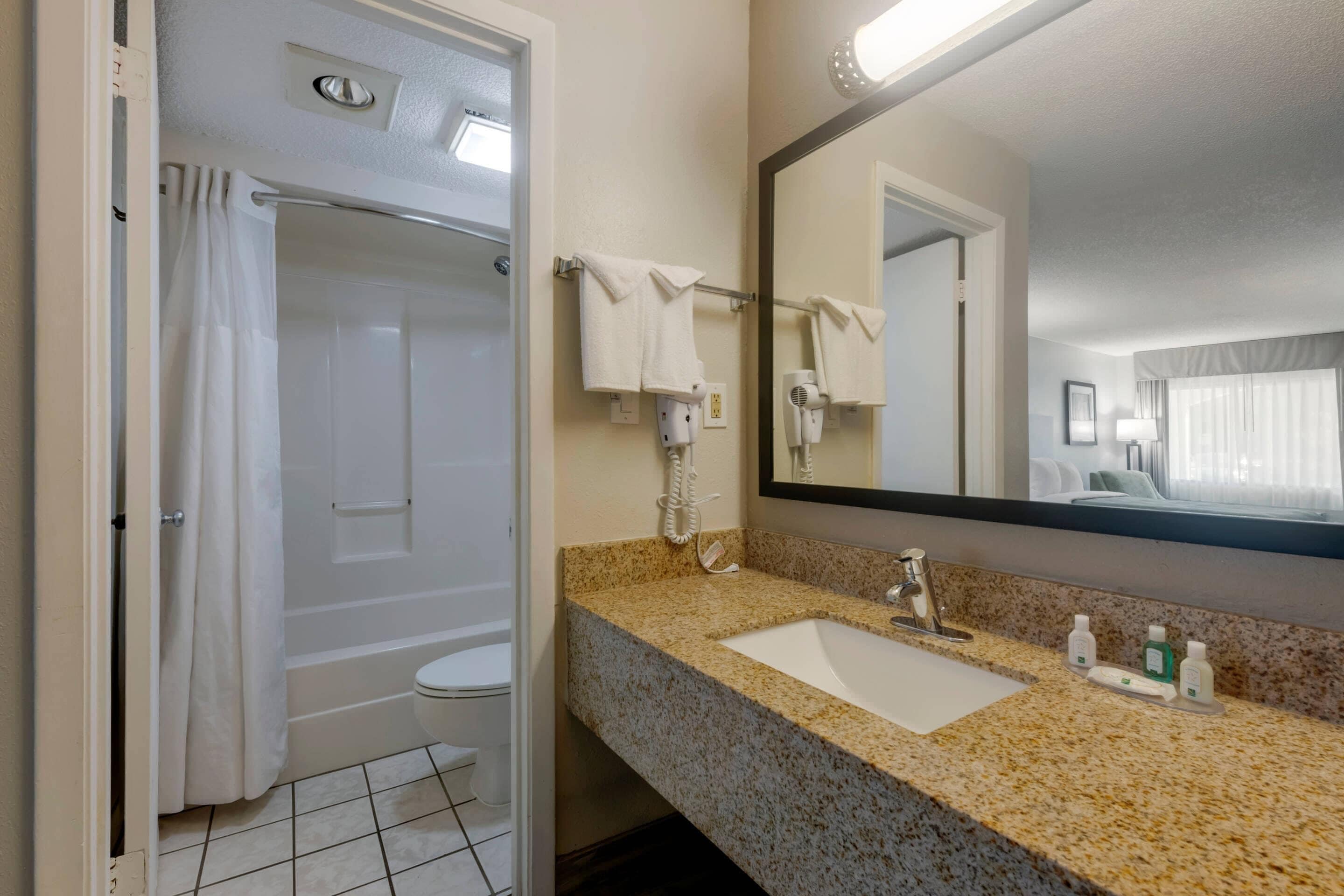Standard Room, 2 Queen Beds, Non Smoking | Down comforters, desk, laptop workspace, blackout drapes
