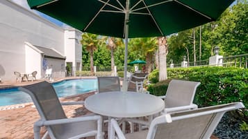 Outdoor pool, open 9 AM to 9:00 PM, pool umbrellas, pool loungers