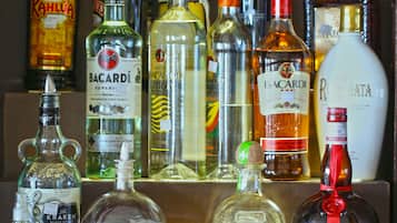 A variety of liquor bottles displayed on a shelf.