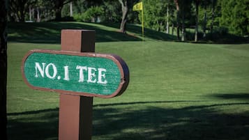 A golf course sign with the text "NO. 1 TEE".
