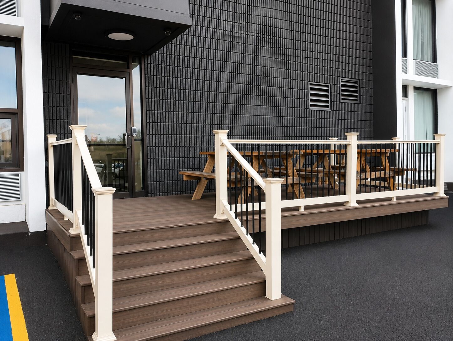A staircase leading to a deck with outdoor seating.