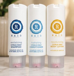 Three bottles of RAIO products: revitalizing citrus mint shampoo, hydrating citrus mint conditioner, and moisturizing citrus mint body lotion.