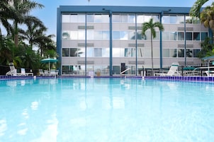 Outdoor pool, open 9:00 AM to 9:00 PM, pool umbrellas, sun loungers