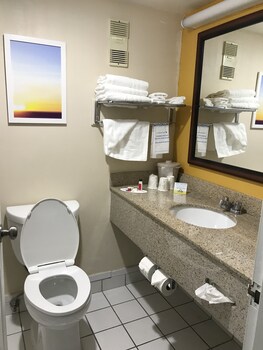 Combined shower/tub, deep soaking tub, free toiletries, hair dryer at enVision Hotel Miami International Airport