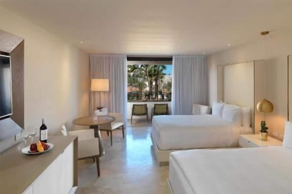 Premium bedding, down comforters, pillowtop beds, free minibar