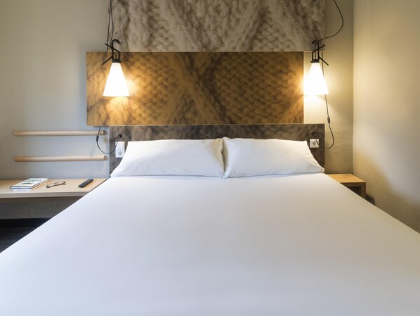 Premium bedding, desk, laptop workspace, blackout curtains