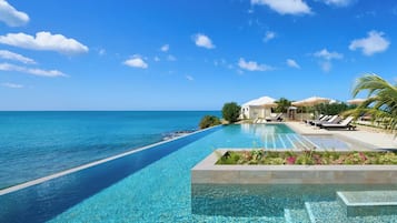 Outdoor pool, open 9 AM to 6 PM, pool loungers