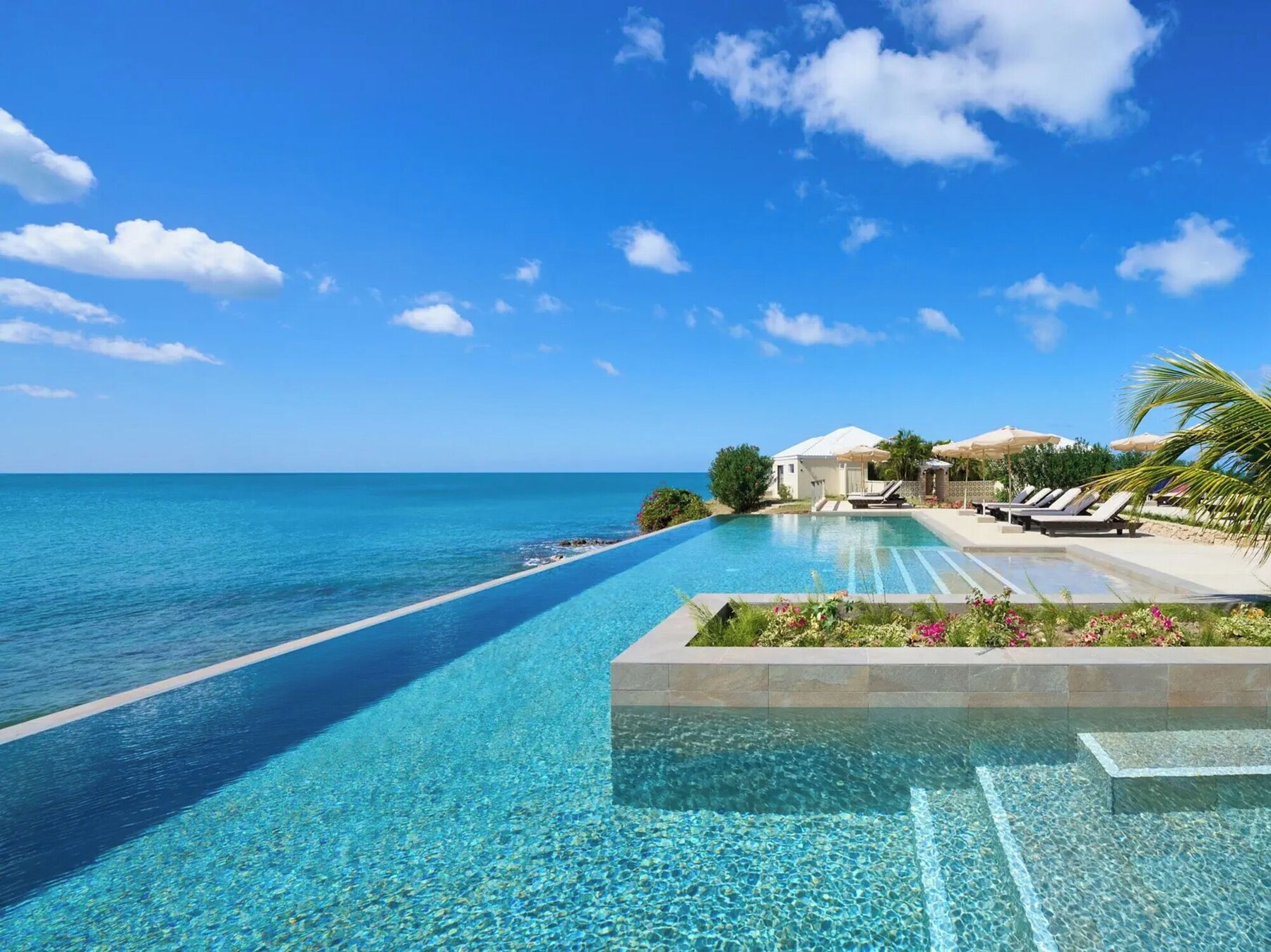 Outdoor pool, open 9 AM to 6 PM, pool umbrellas, pool loungers