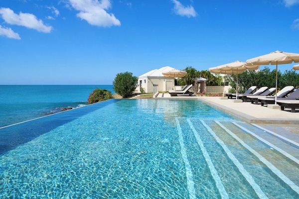 Outdoor pool, open 9 AM to 6 PM, pool umbrellas, sun loungers