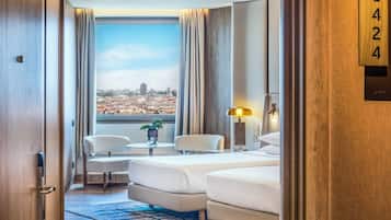 Panoramic Twin Room, City View | Minibar, in-room safe, desk, laptop workspace