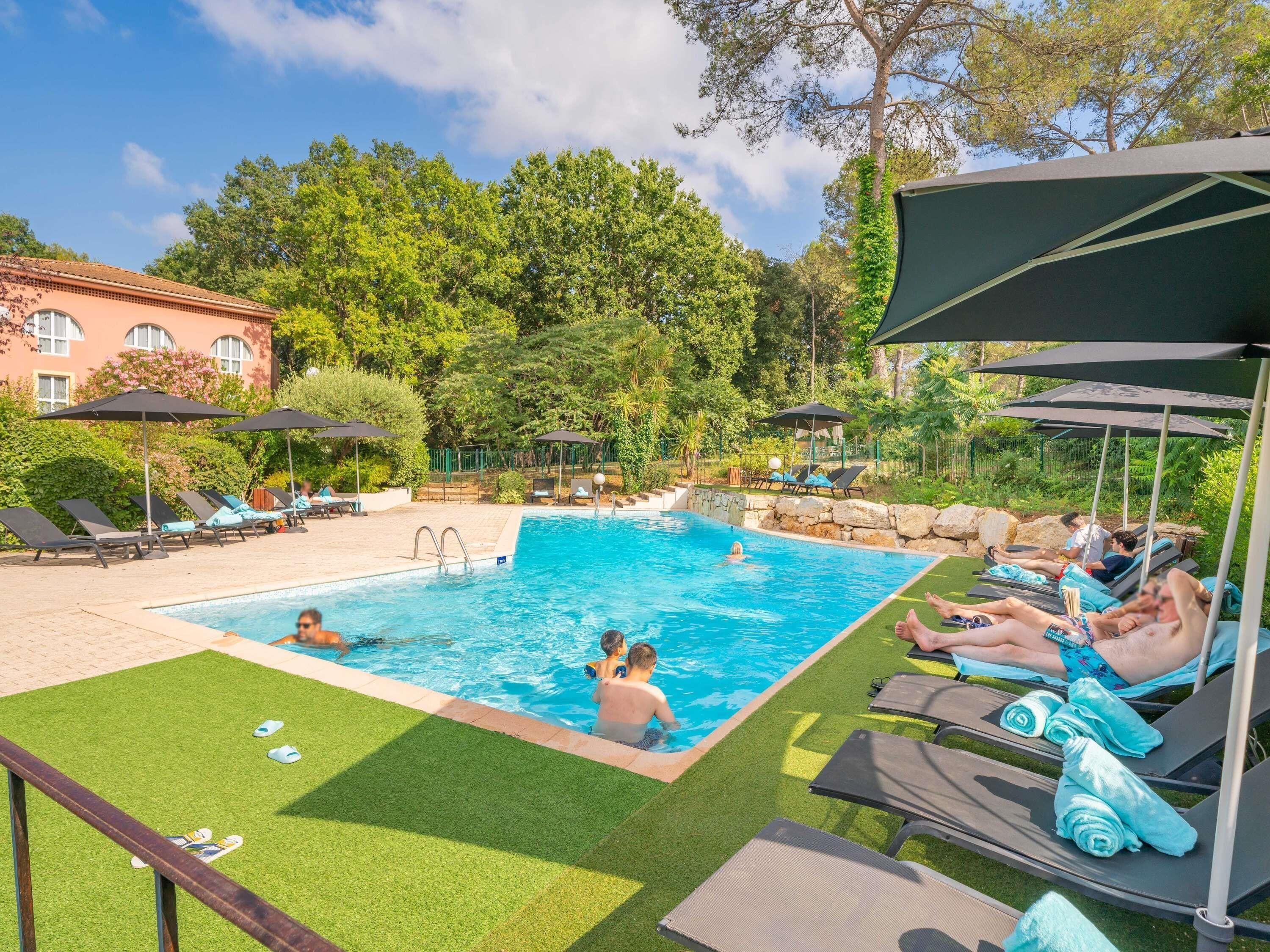 Outdoor pool, pool umbrellas, pool loungers