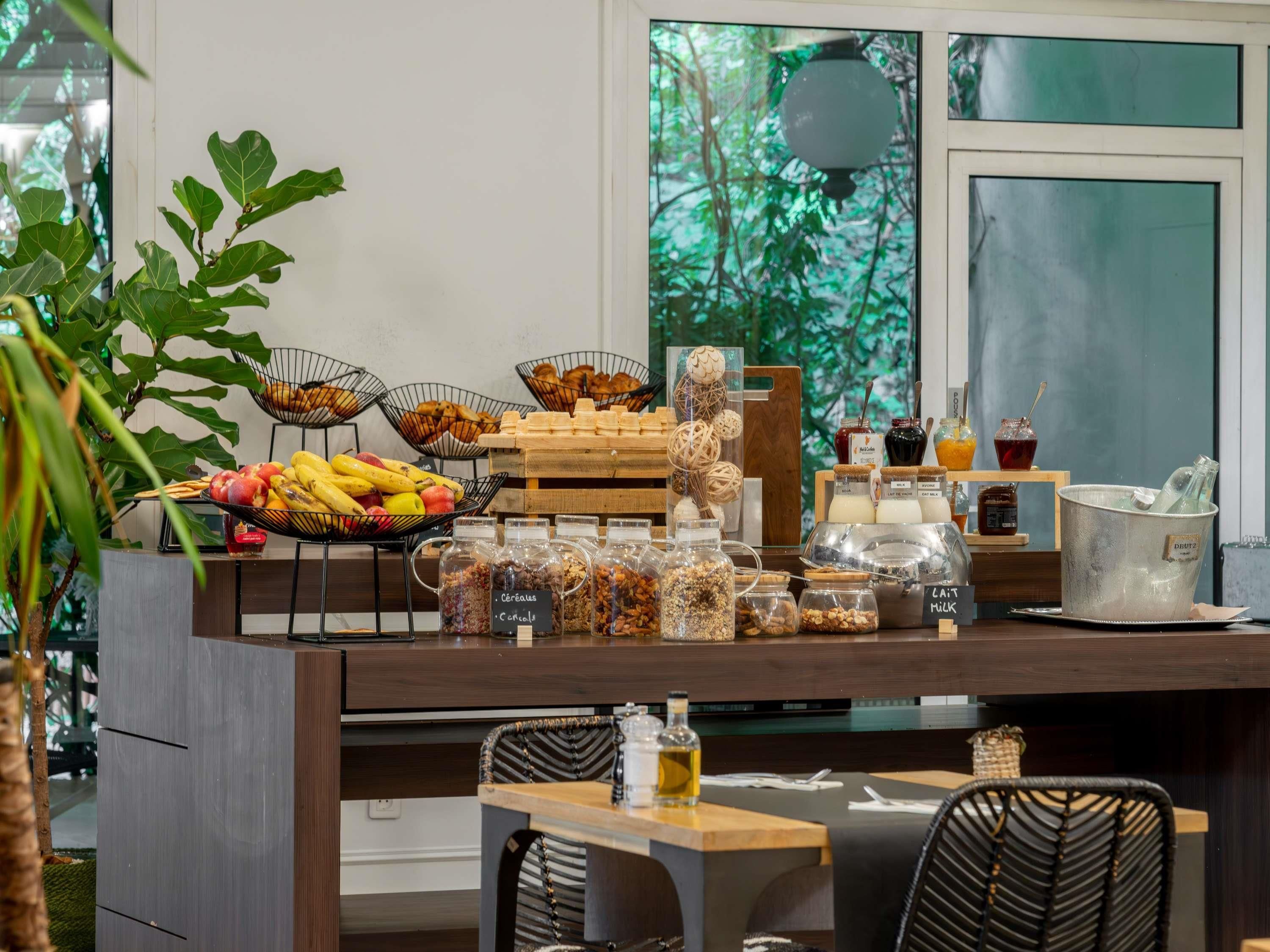 A breakfast buffet with various food items and beverages.